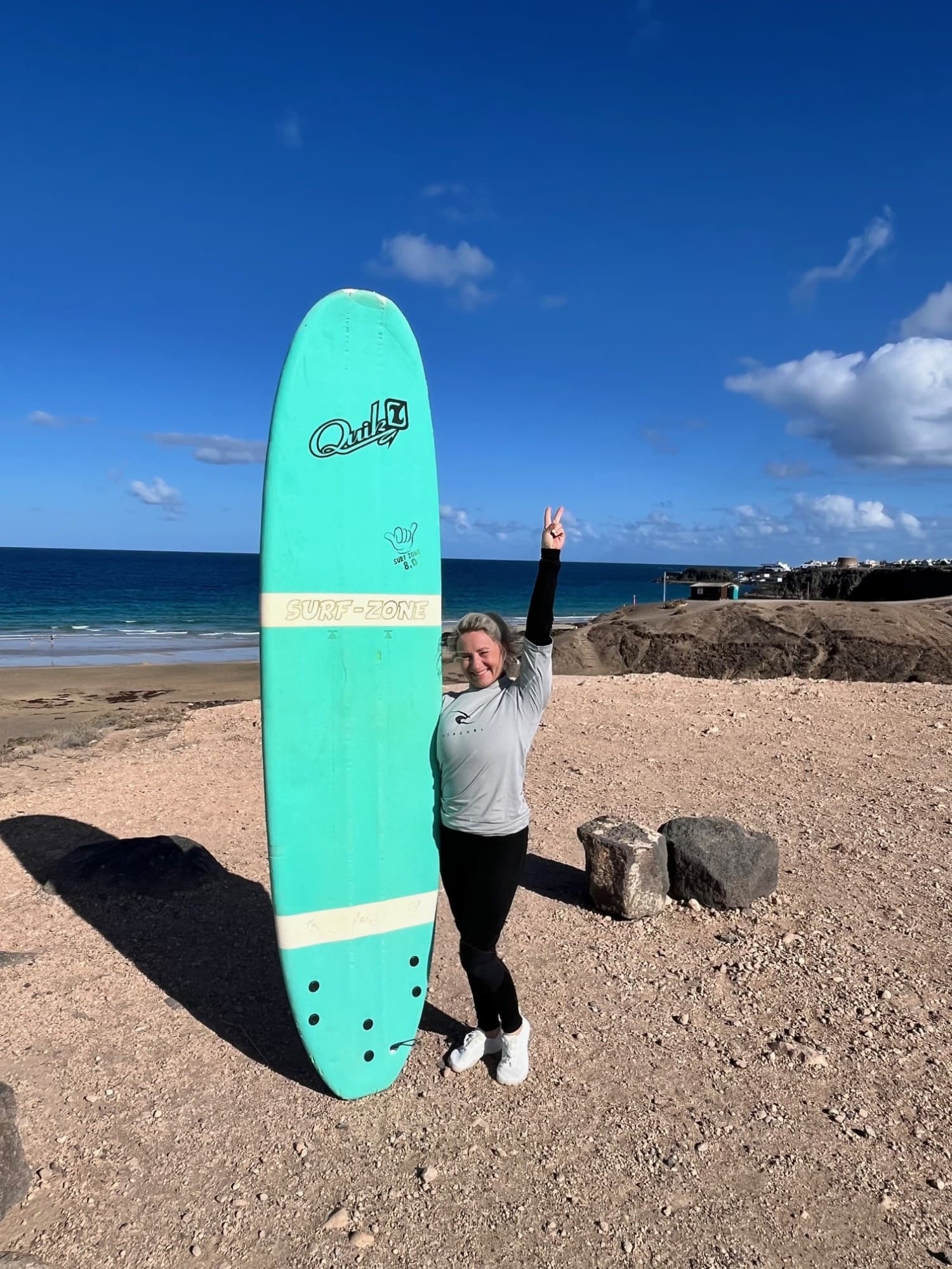 A portrait of Sonja and Emiljano Peter. She is wearing a dirndl and he is wearing dungarees.